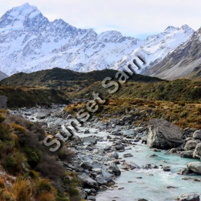 Curving creek in mountains Thumbnail